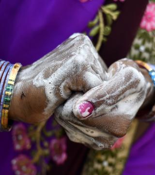 Closeup of woman washing her hands. Photo: UNICEF