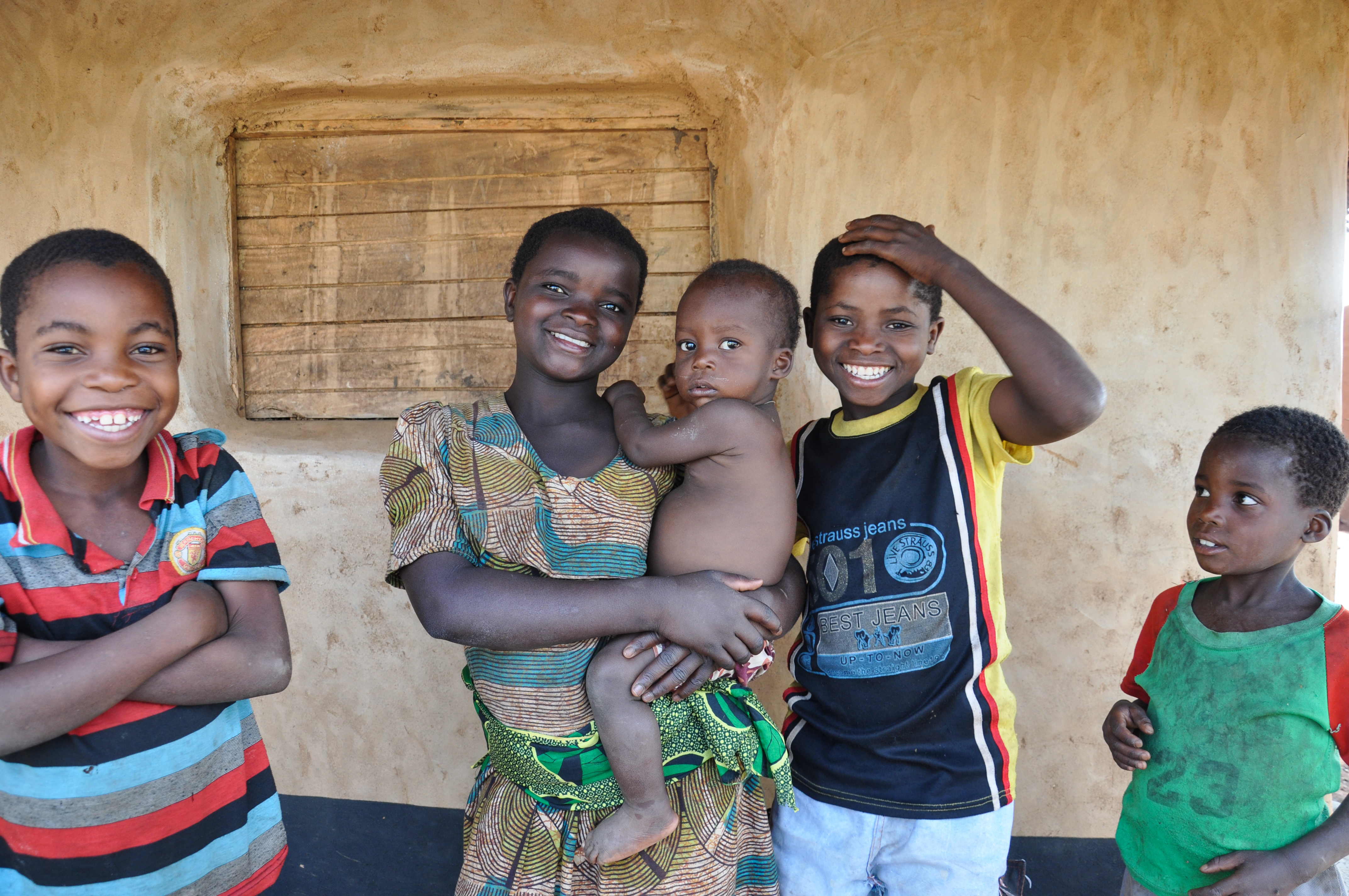Smiling Malawian family with an infant