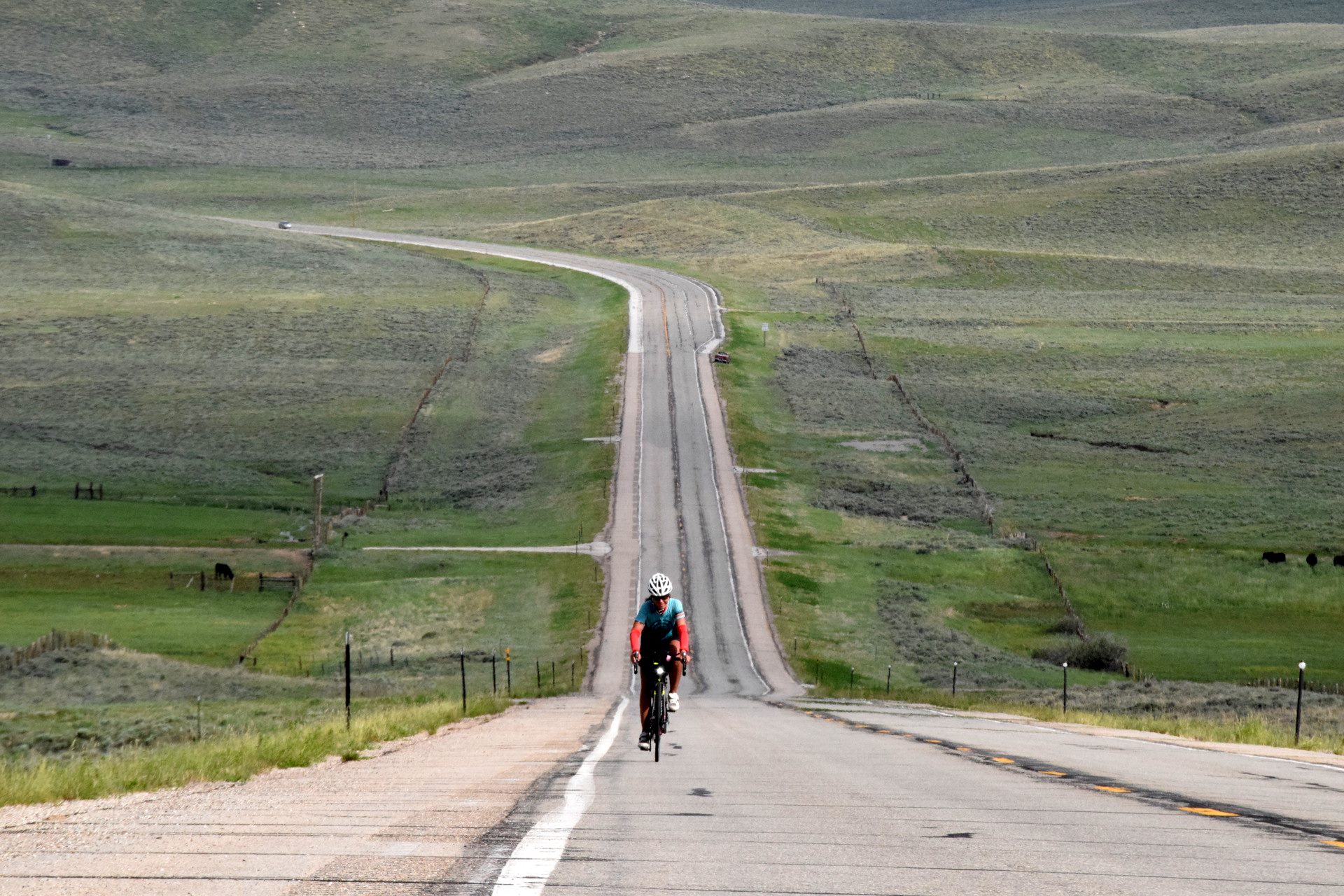 Janie Hayes rides a bike near the Colorado-Wyoming border in the 2016 Trans America Bike Race. Photo credit: Anthony Dryer.