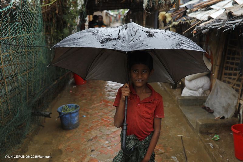 Young boy holding an umbrella