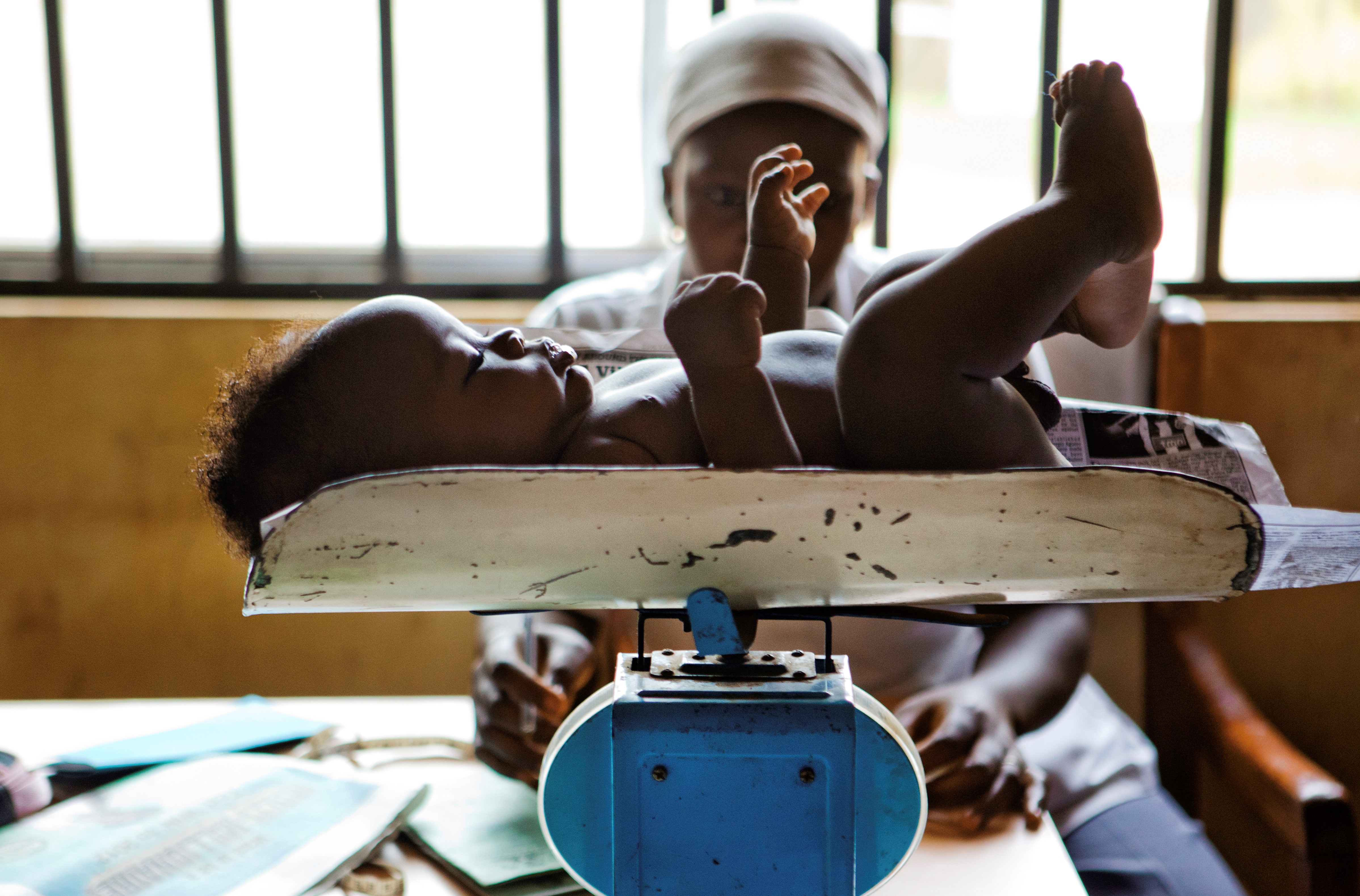 Baby is weighed on a scale at Kuje Primary Health Care Center in Kuje, Nigeria. 