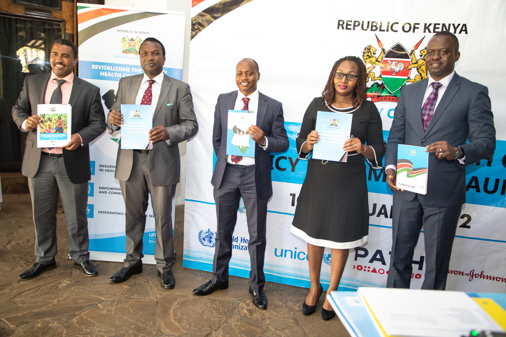 Stakeholders hold copies of the primary healthcare policy