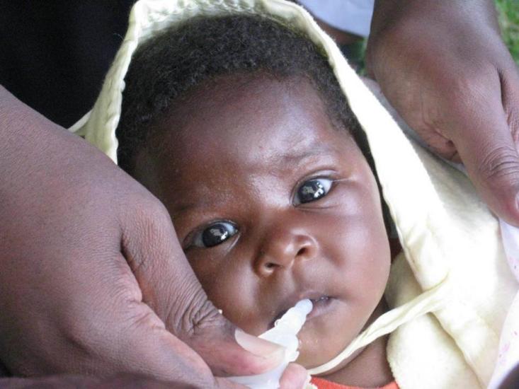 A baby in Rwanda receives rotavirus vaccine at the launch in 2012. Photo: Merck