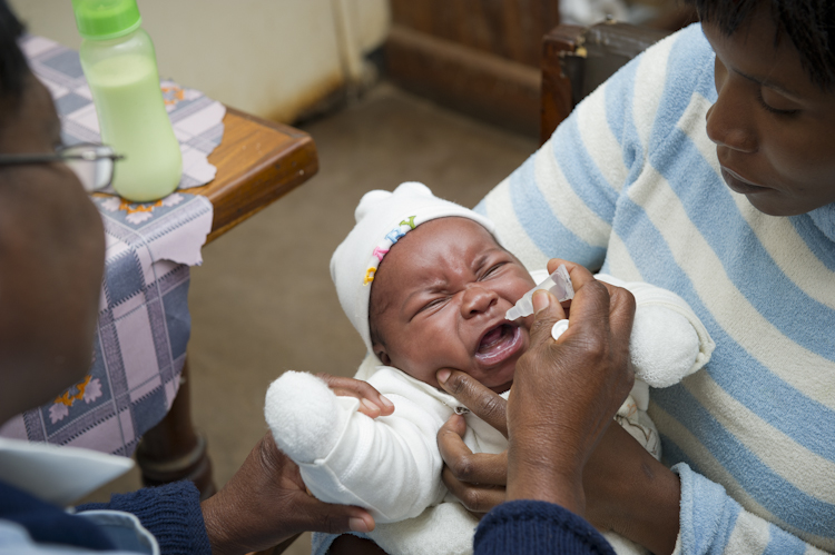 Infant Vusi Jeri receives oral rotavirus vaccine in Zambia