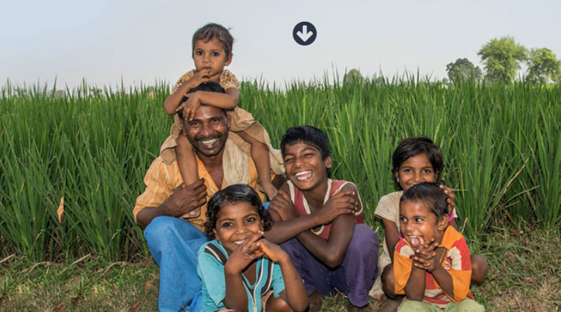 Indian family smiling at the camera