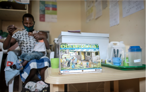 A mother spoon-feeds her child oral rehydration solution in the oral rehydration therapy corner of Malava County Hospital in Kakamega, Kenya. 
